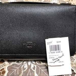 Coach double zip travel organizer wallet with handle.